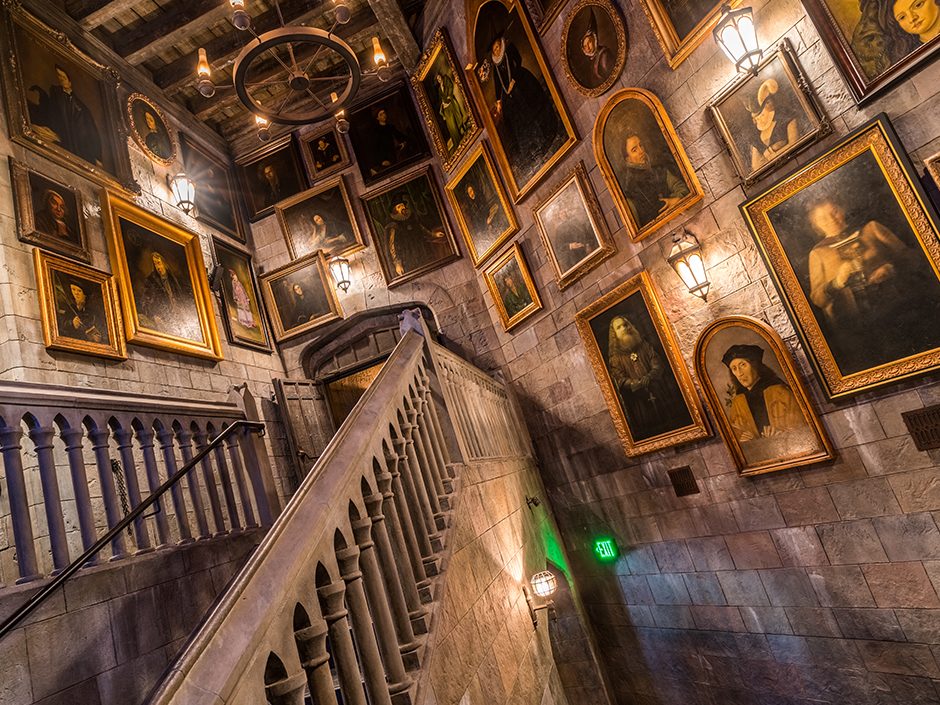 The queue for Harry Potter and the Forbidden Journey, with walls that are lined with portraits.