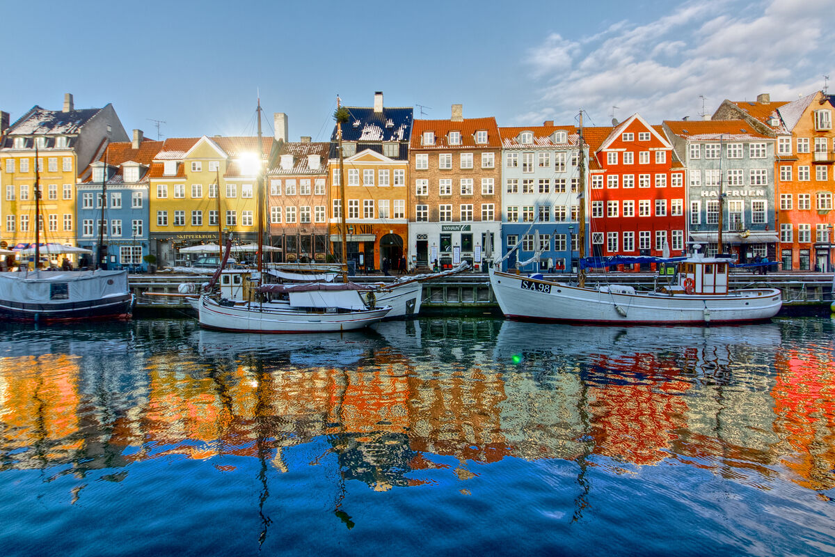 Charming European village along a river at sunset